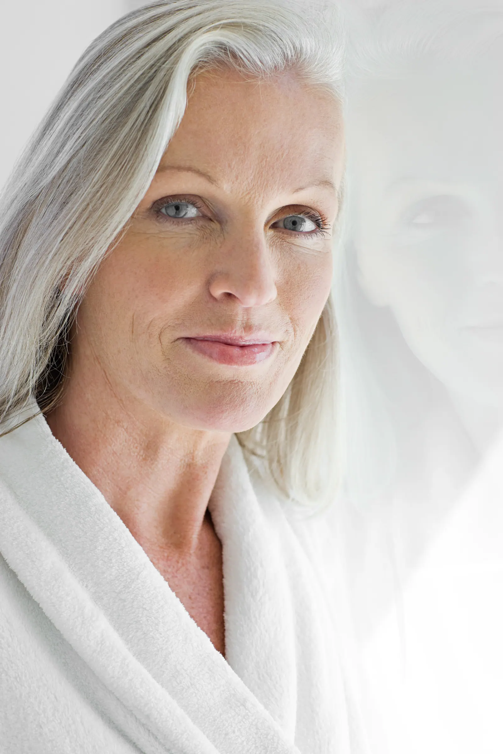 Close up of a mature woman in white robe
