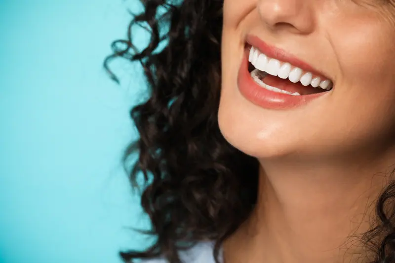 Close up of a woman smiling with white teeth