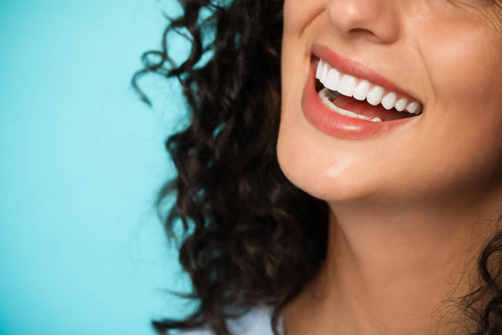 Close up of a woman smiling with white teeth