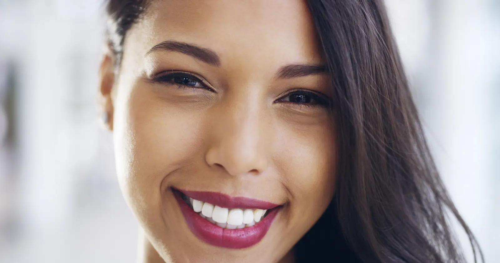 Close up of woman s face with bright smile