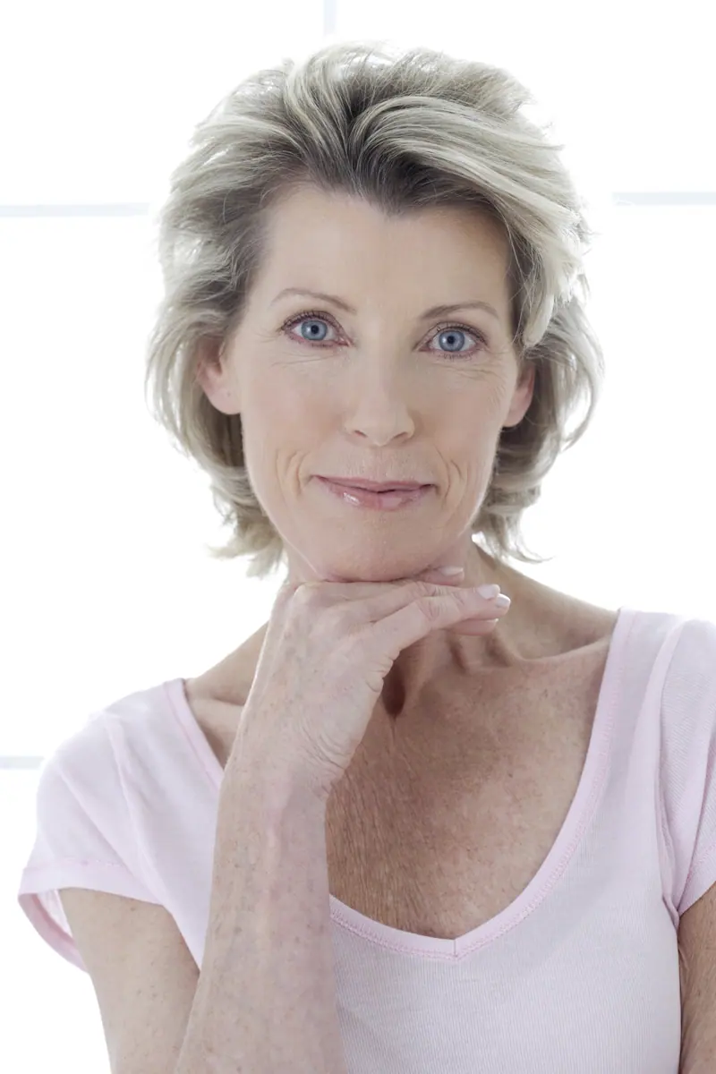 Elegant woman posing in a studio setting