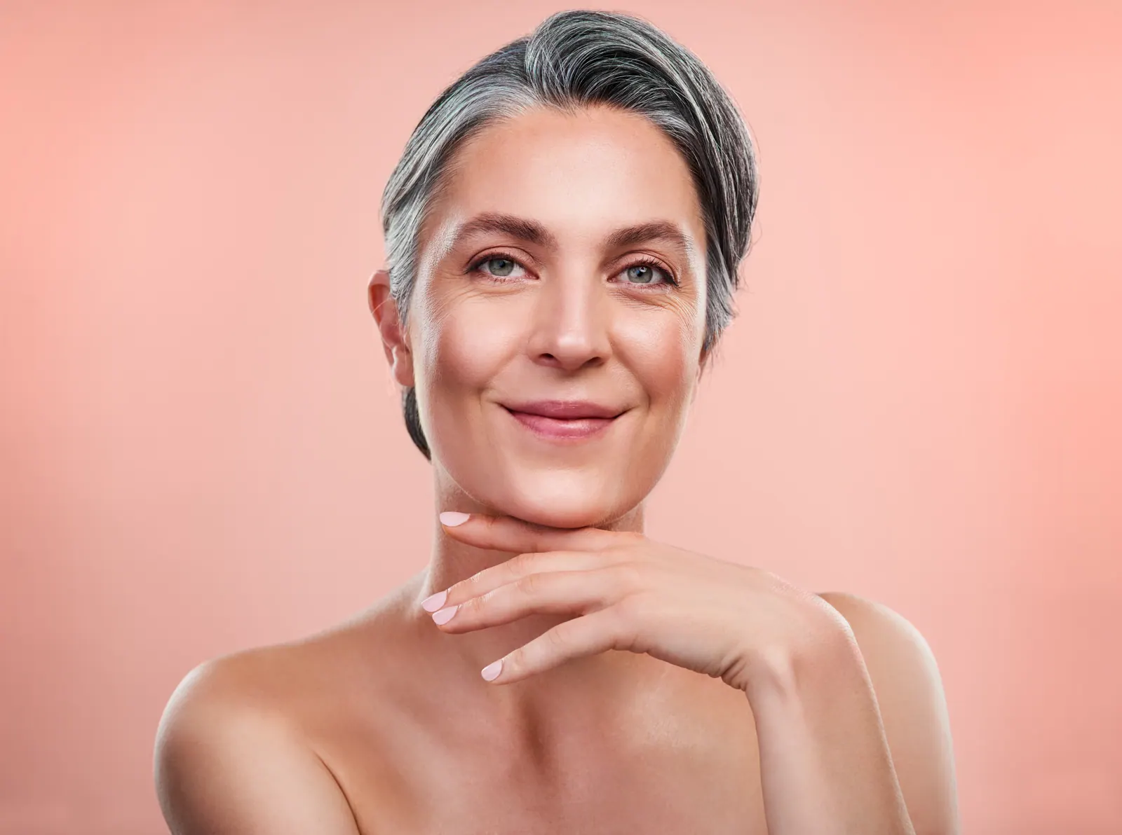 Elegant woman posing with hand under chin