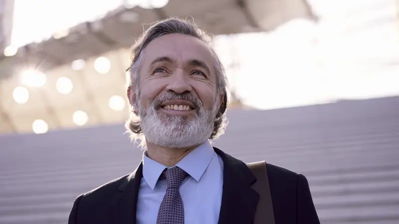 Man in suit jacket smiling