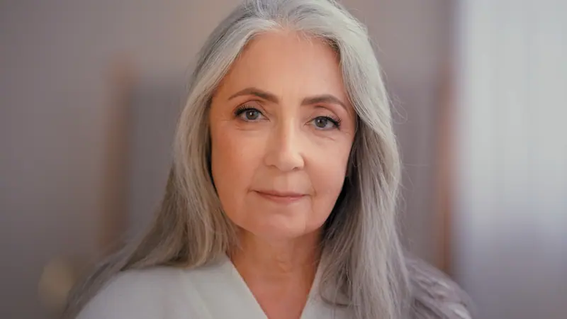 Mature woman portrait with long gray hair