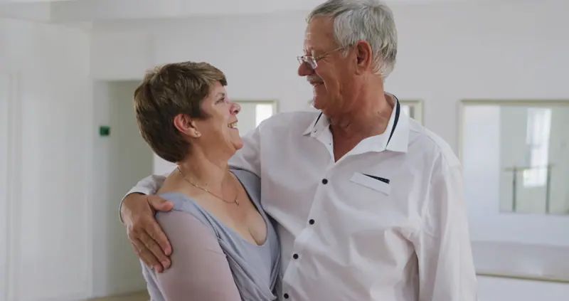 Senior couple embracing and looking at each other