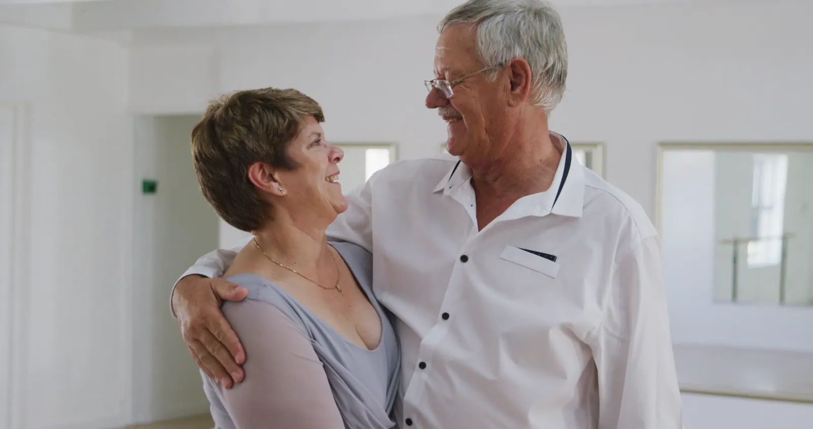 Senior couple embracing and looking at each other