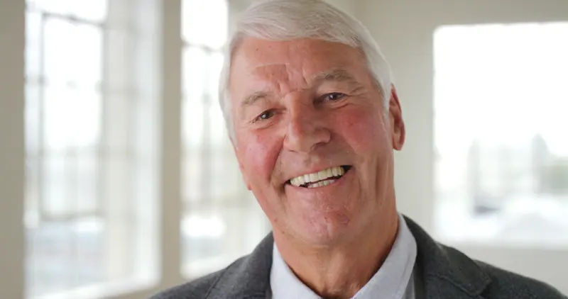 Senior man smiling close up portrait indoors
