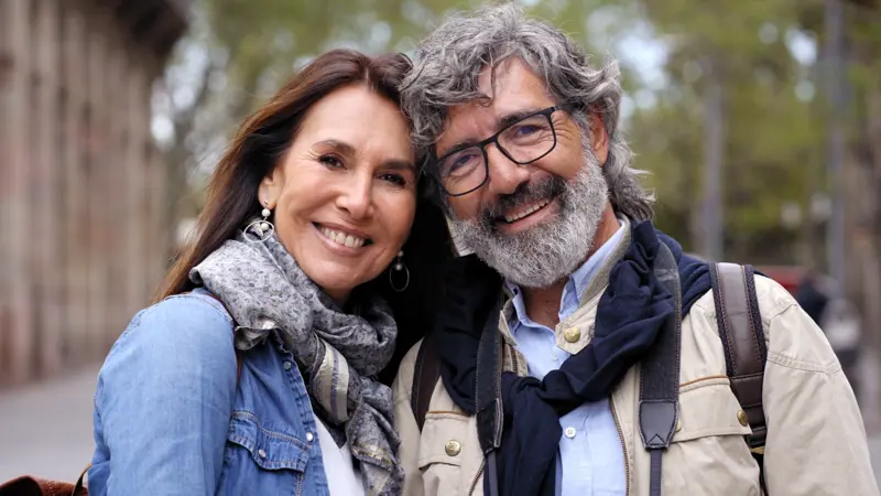 Smiling couple enjoying city travel together