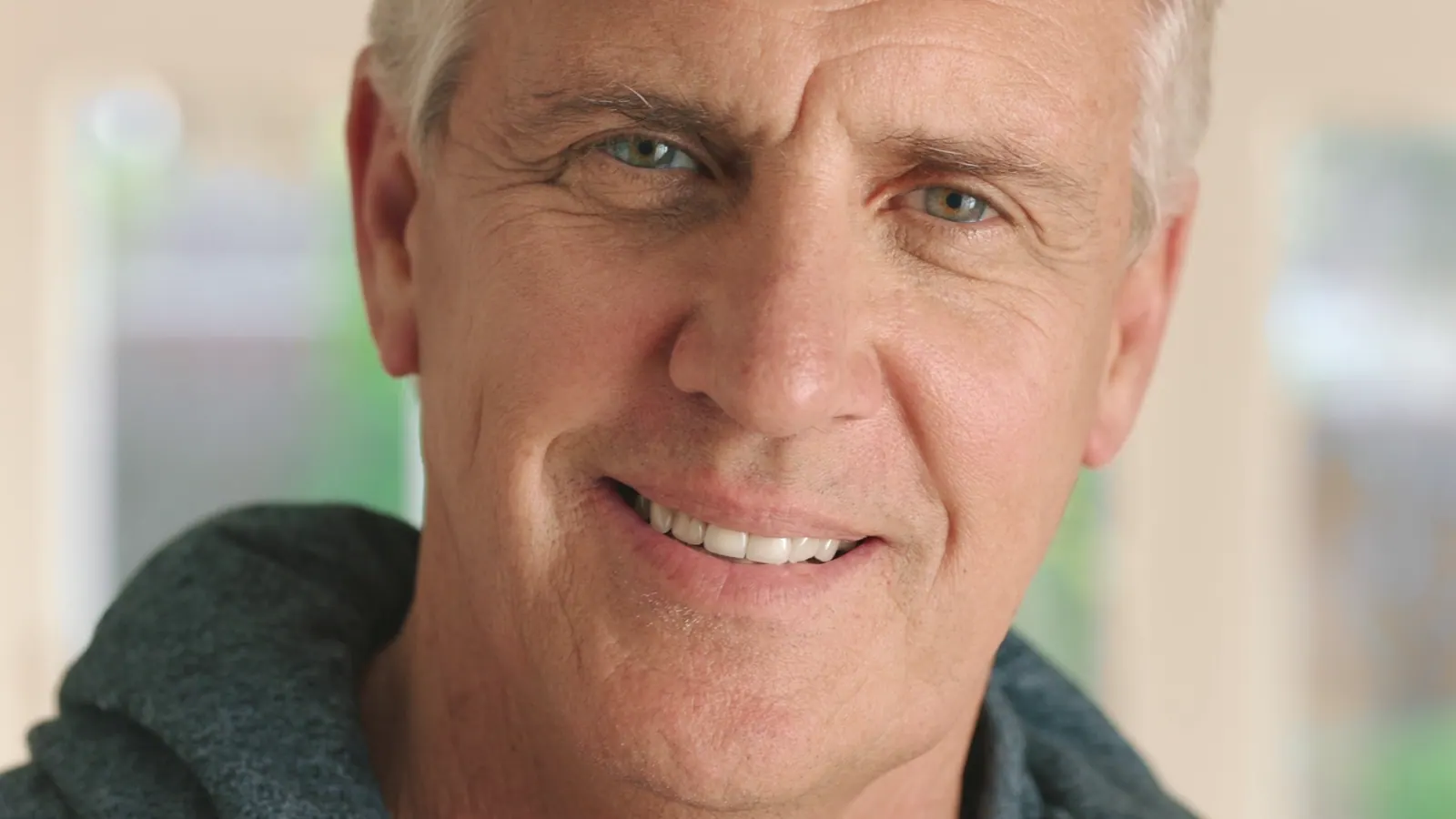 Smiling man looking at camera close up