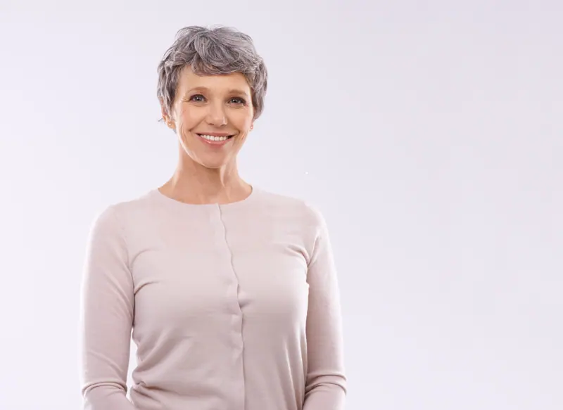 Smiling senior woman portrait on white background