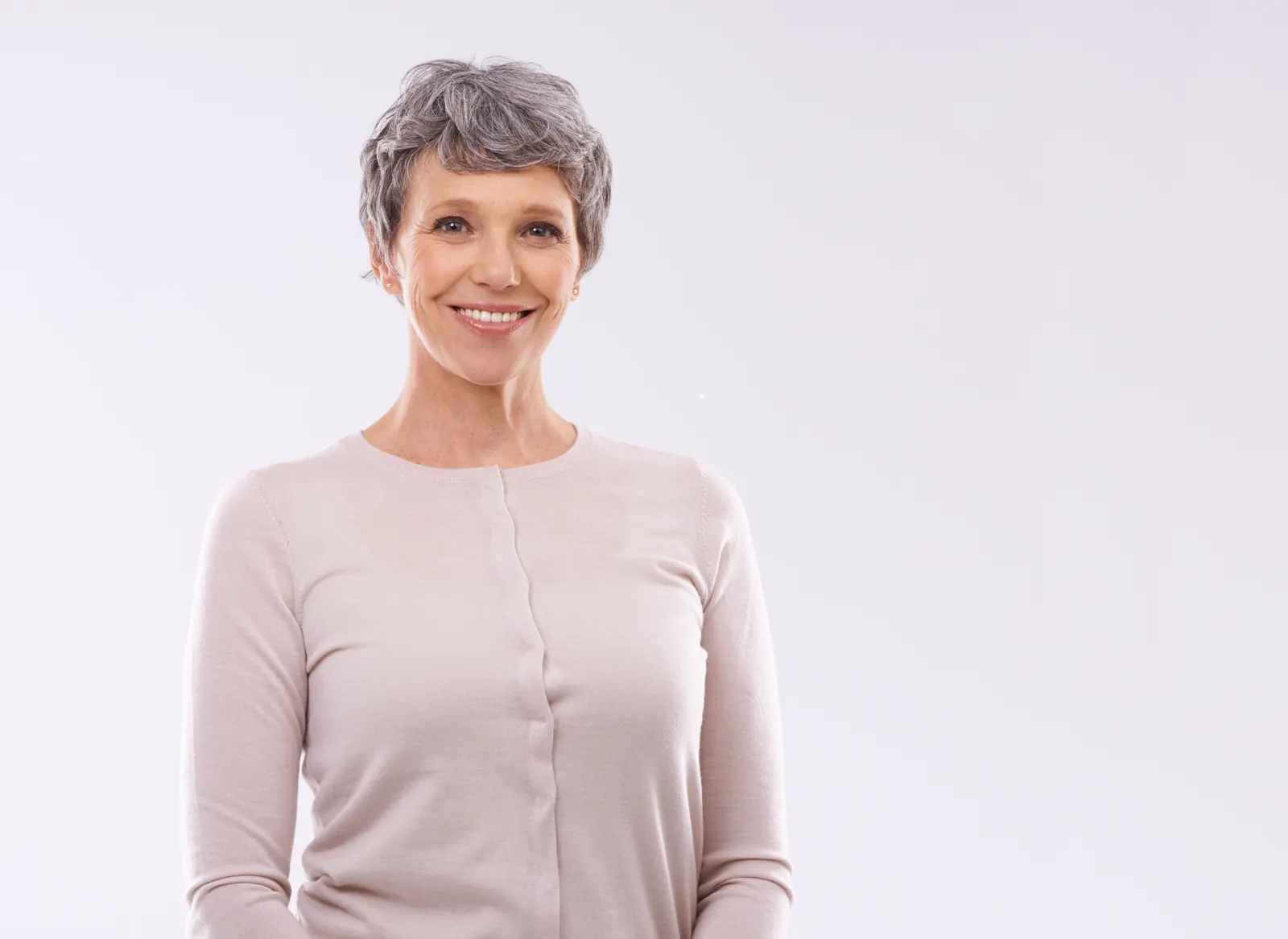 Smiling senior woman portrait on white background