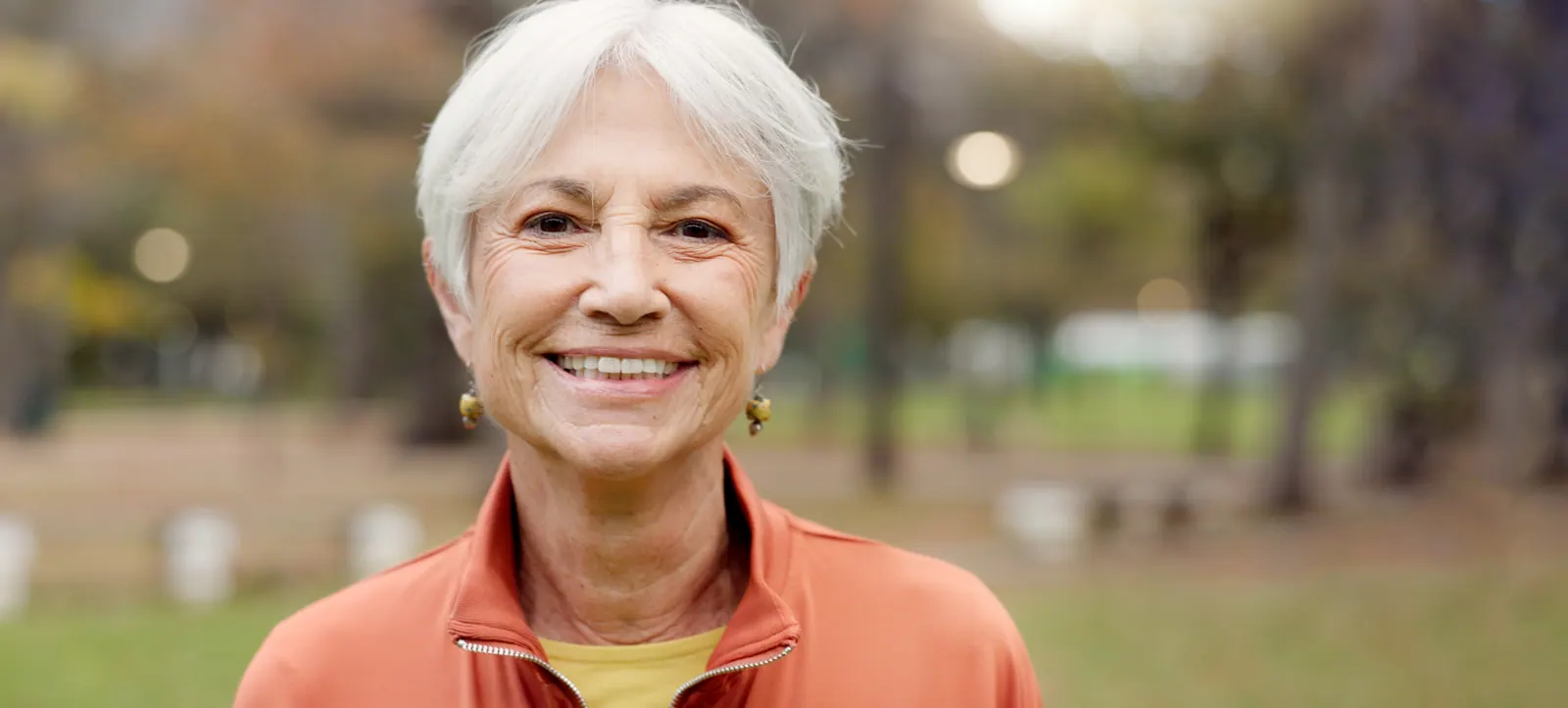 Smiling senior woman portrait outdoors in natural
