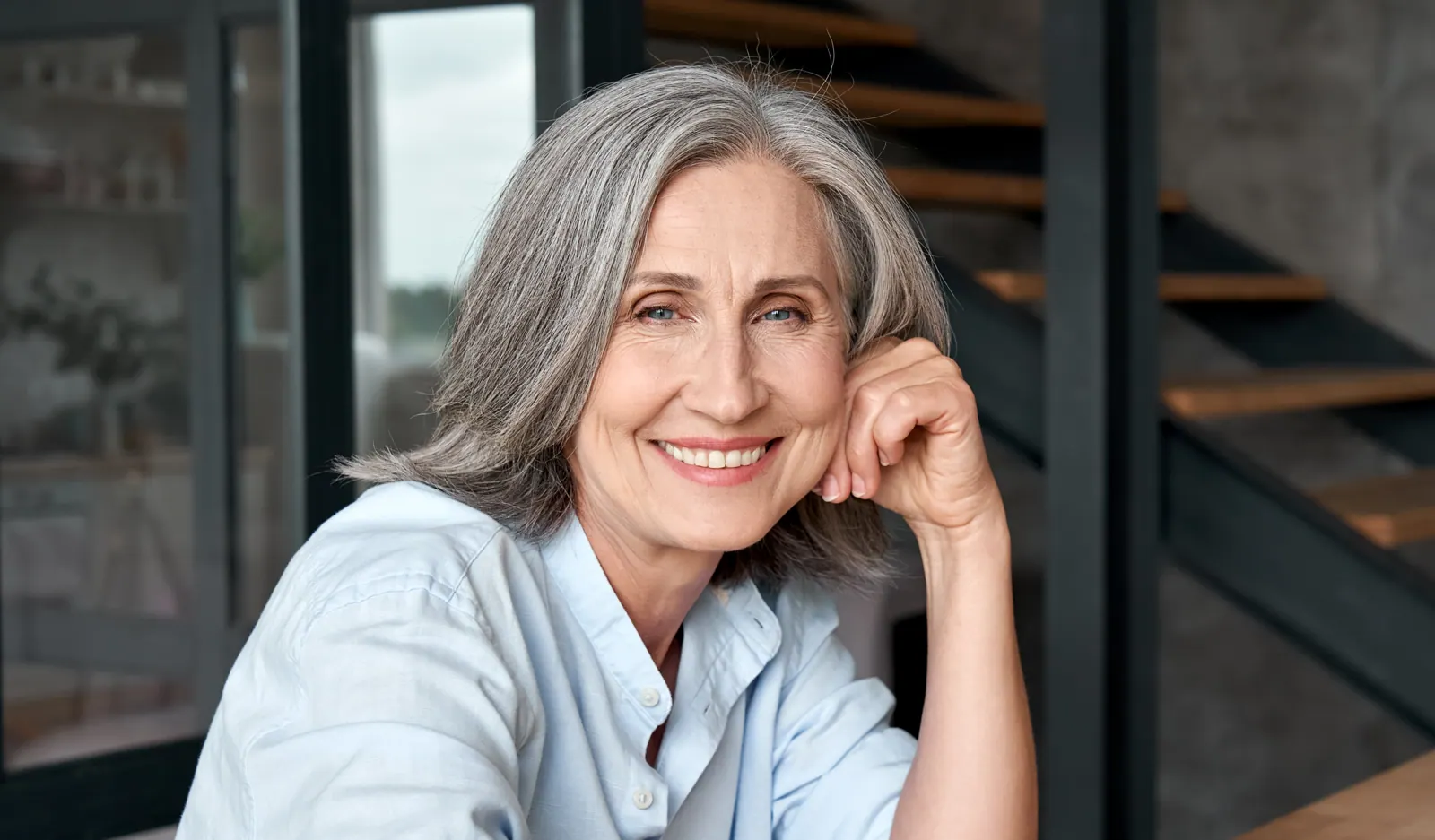 Smiling senior woman relaxing at home