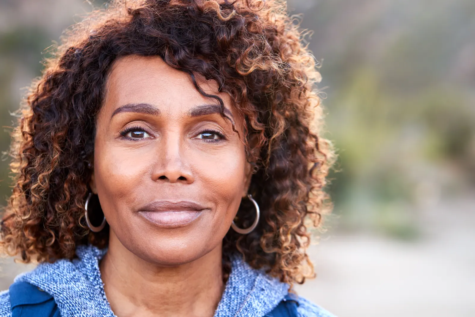 Smiling woman portrait outdoors in natural setting