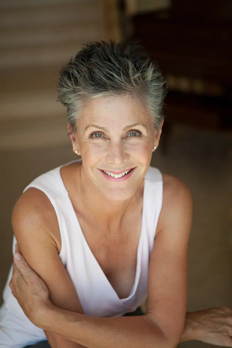 Smiling woman portrait with short grey hair