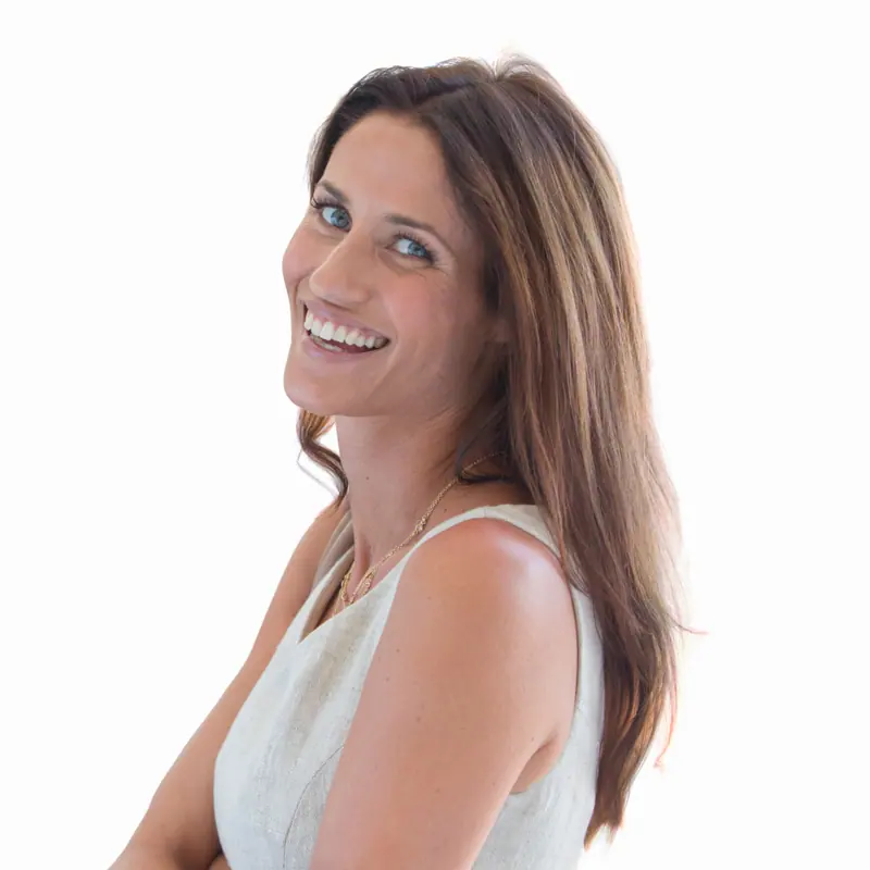Smiling woman posing indoors on white background