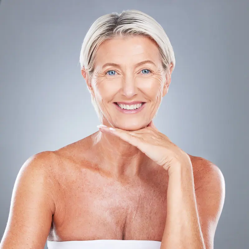 Smiling woman with short blonde hair posing